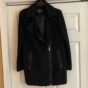 London Fog black ladies medium coat with diagonal zip front.  Wool blend.
